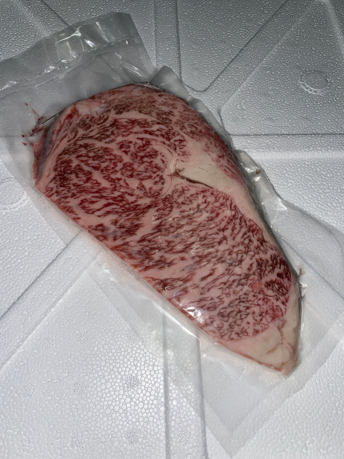 A5 Omi Emperor Ribeye — BMS 8-12 Japanese A5 Wagyu, Shiga Prefecture (Omi Beef) — cooked and sliced