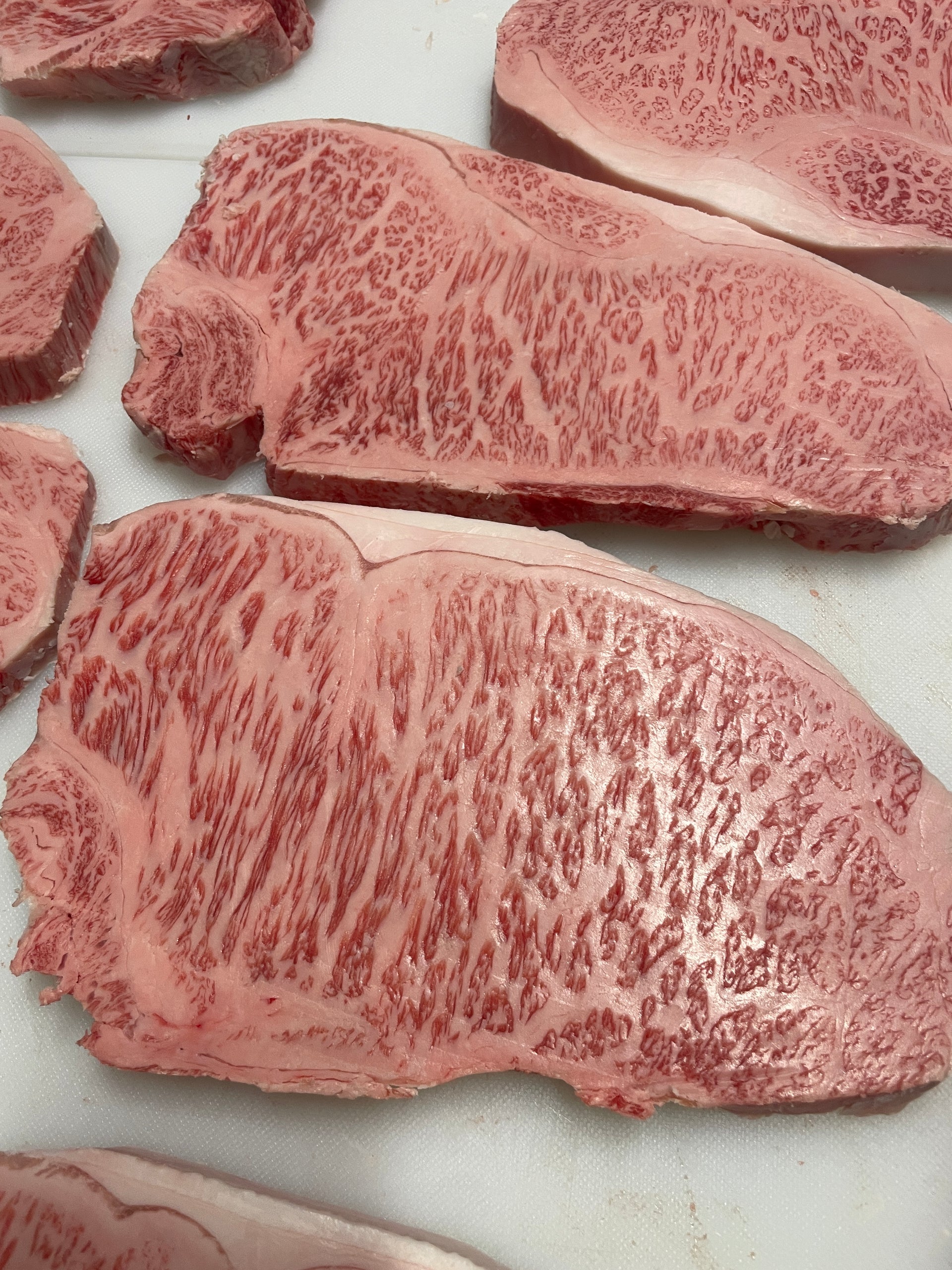 A5 Sanuki Olive-Fed NY Strip — BMS 8-12 Japanese A5 Wagyu, Kagawa Prefecture — cooked and sliced