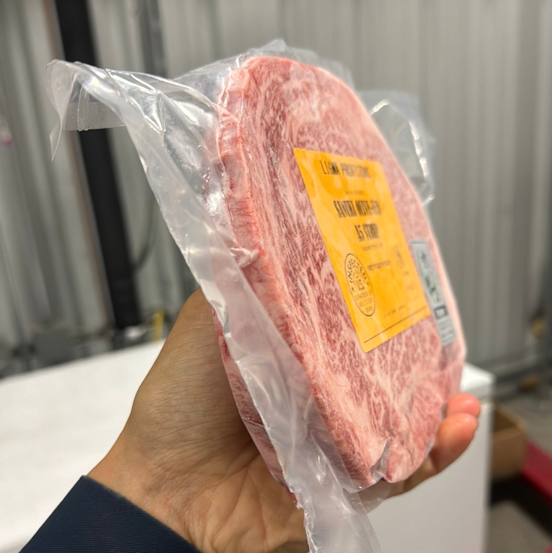 A5 Sanuki Olive-Fed NY Strip — BMS 8-12 Japanese A5 Wagyu, Kagawa Prefecture — close-up texture