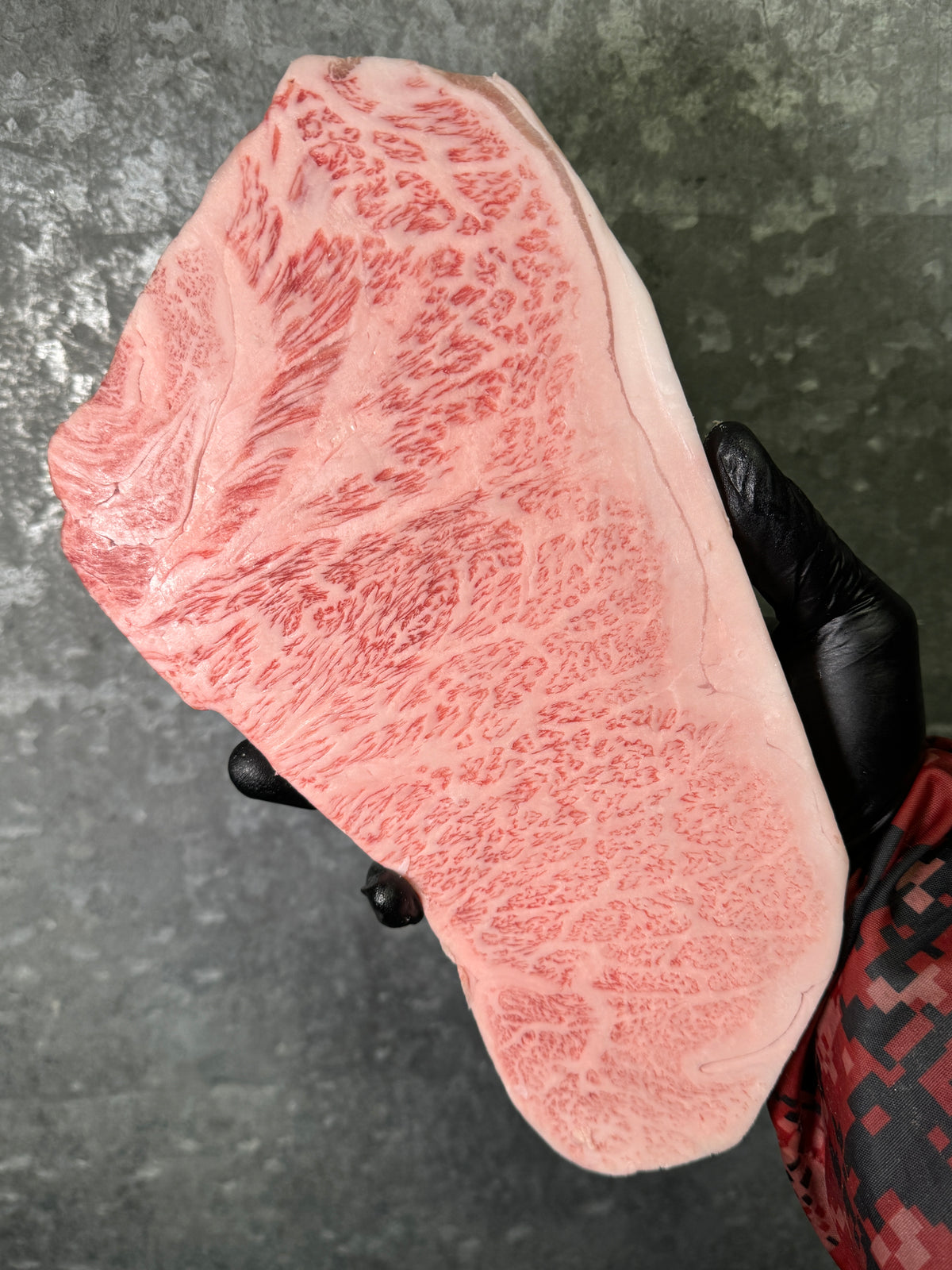A5 Takamori Sake-Fed NY Strip — BMS 8-12 Japanese A5 Wagyu, Yamaguchi Prefecture — cooked and sliced