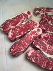 USDA Prime NY Strip - 60 Day Dry Aged — USDA Prime grade beef