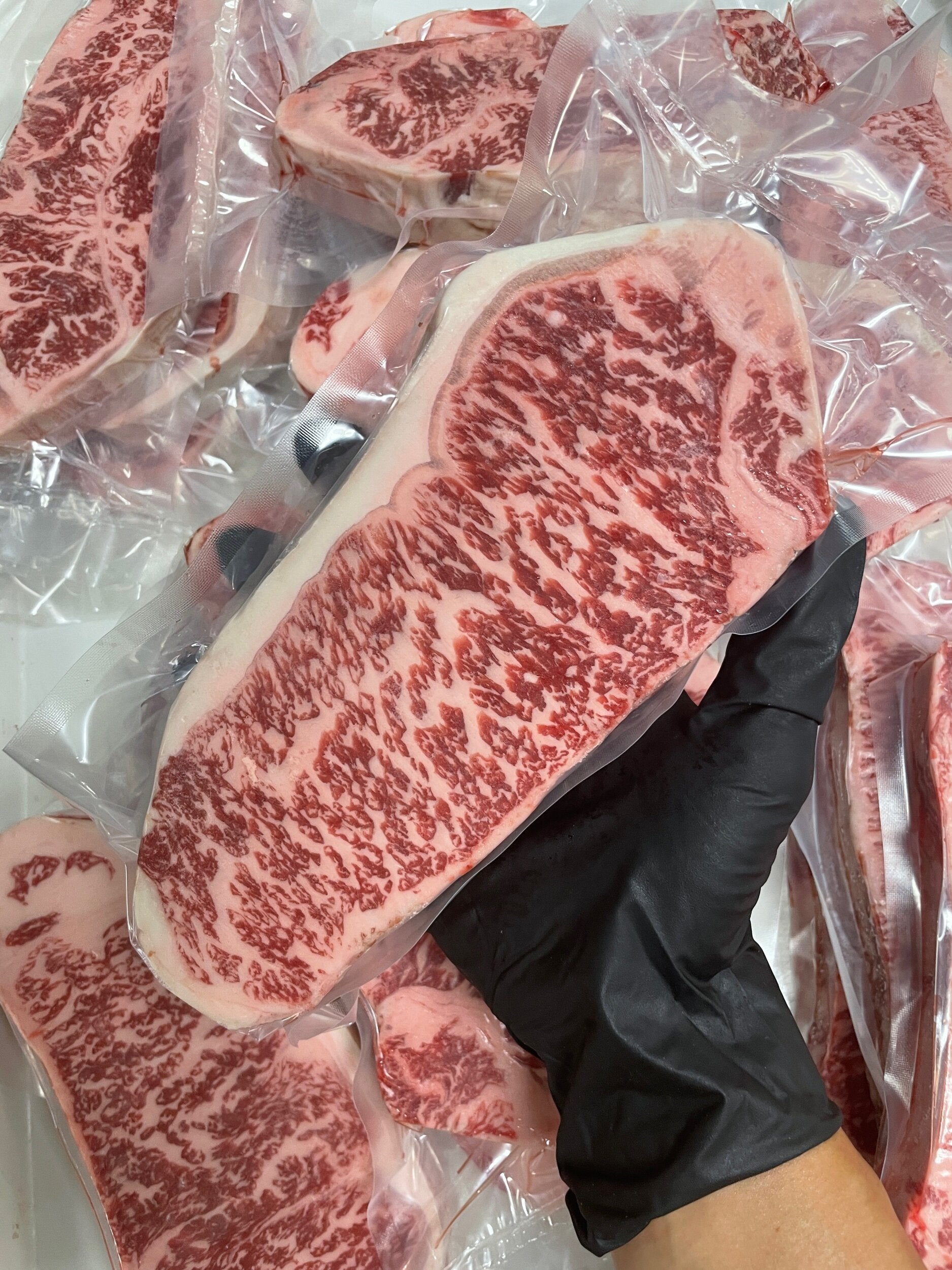 Australian Wagyu NY Strip Gold — BMS 8/9 Australian Wagyu Gold Label — cooked and sliced