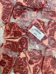Australian Wagyu NY Strip Green — BMS 7/8 Australian Wagyu Green Label — cooked and sliced